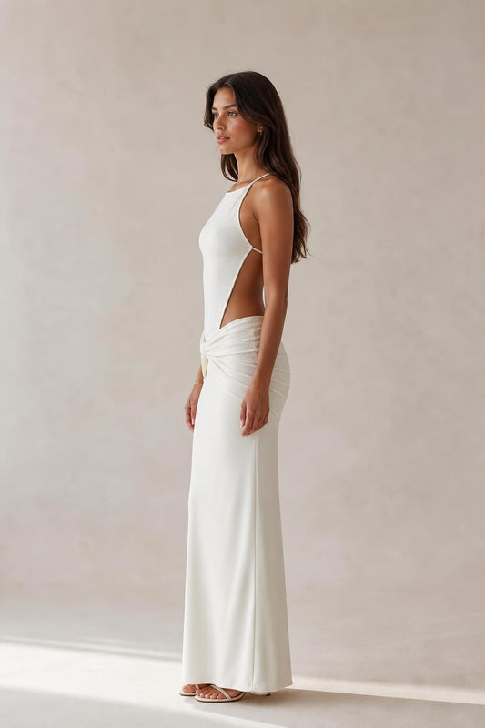 Side profile view of white cut-out maxi dress