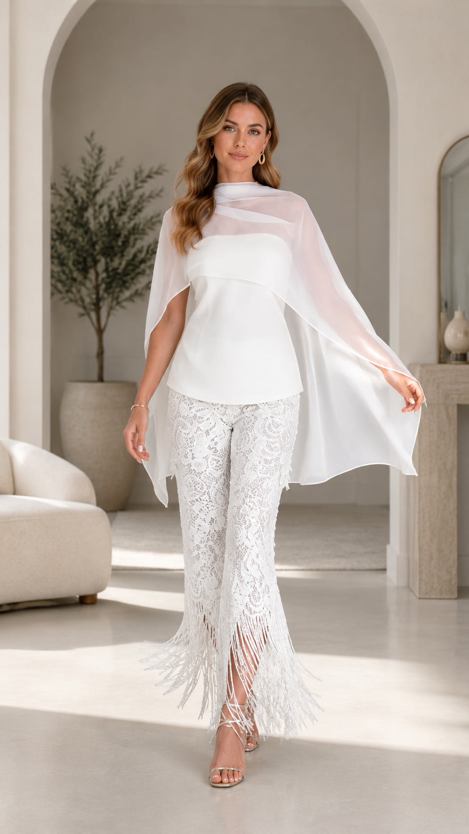 Front view of white chiffon cape top and lace fringe pants set