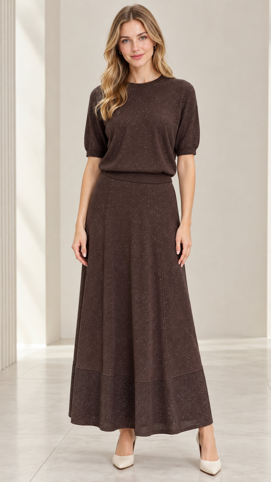 Front full-length view of model wearing coffee brown shimmer knit top and matching maxi skirt set