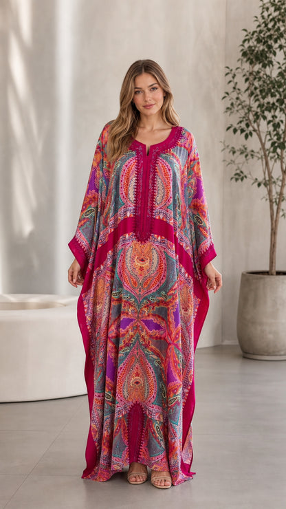 Front view of model wearing Fuchsia paisley embroidered kaftan maxi dress
