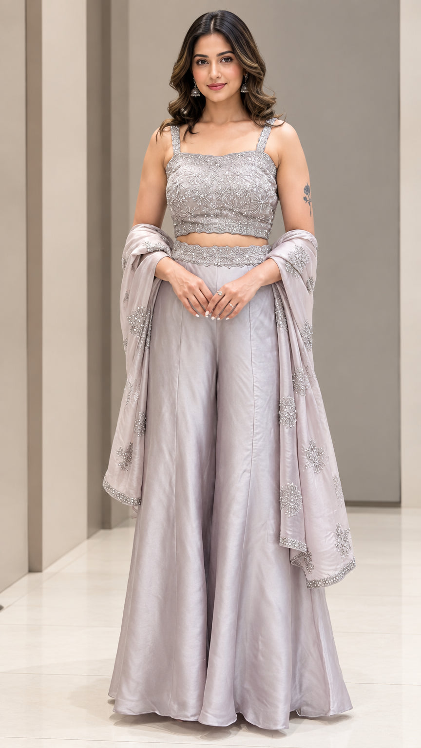 Front full-length view of woman wearing Silver Grey embroidered crop top and palazzo pant set with dupatta