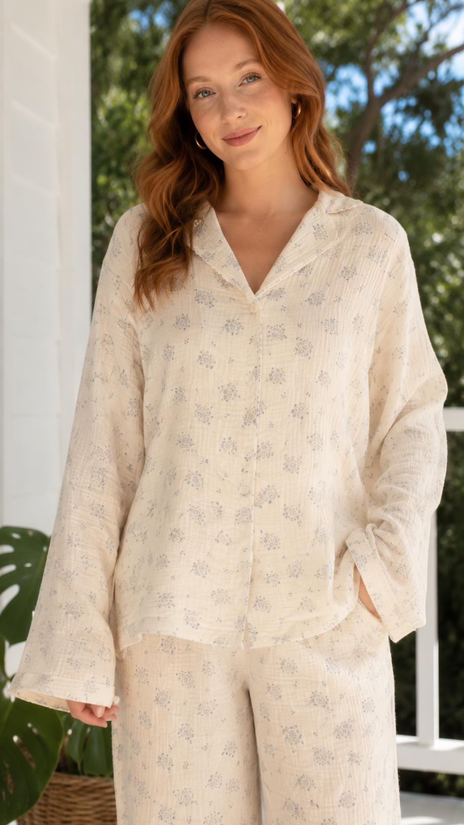 Close-up of cream floral lounge set with long sleeve collared top and matching pants