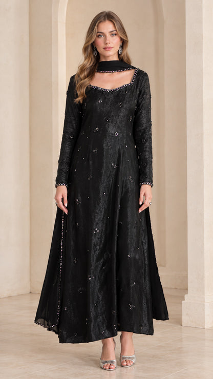 Front view of woman wearing black embellished long sleeve maxi Anarkali gown with matching scarf