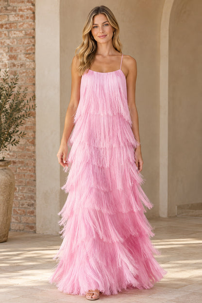 Front view of woman wearing pink tiered fringe spaghetti strap maxi dress