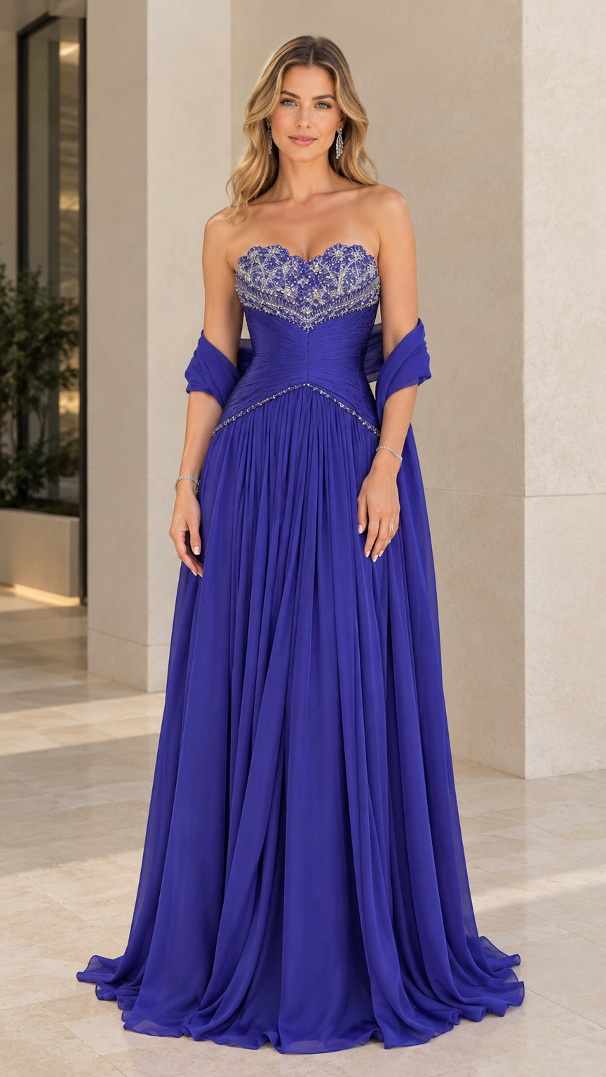 Front view of model wearing Royal Blue strapless beaded pleated chiffon evening gown with matching shawl
