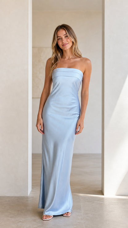 Front view of model wearing a light blue strapless satin maxi dress