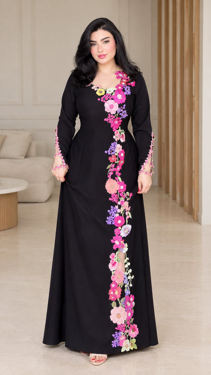 Front full view of black modest maxi dress with pink and purple floral embroidery
