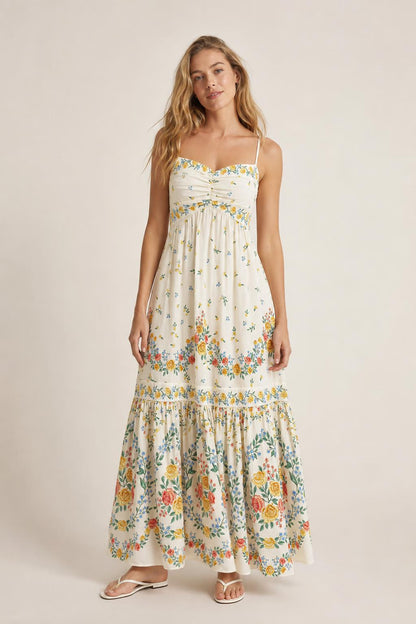 Front view of cream floral maxi dress on model
