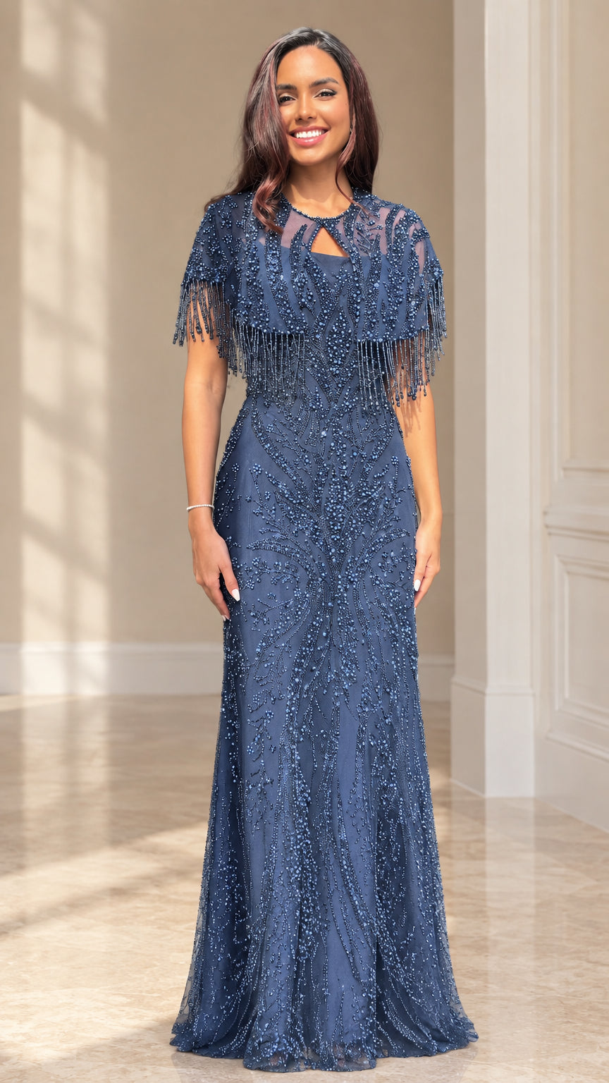 Front view of woman wearing a full-length slate blue beaded evening gown with matching fringe capelet