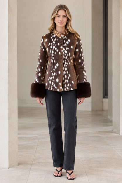 Front view of model wearing brown spotted fawn faux fur jacket with plush cuffs