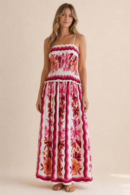 Front view of floral print smocked maxi dress in white
