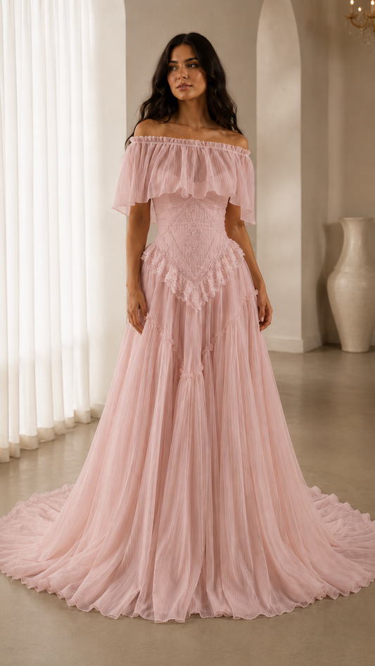 Blush pink off-shoulder ruffle maxi gown with textured bodice and flowing pleated skirt front view