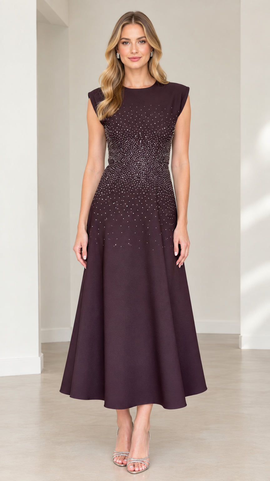 Front view of model wearing plum cap sleeve rhinestone embellished A-line midi dress