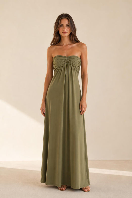 Woman wearing olive green strapless ruched maxi dress front view