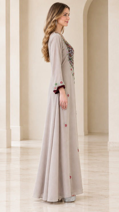 Side profile of beige embroidered A-line maxi dress