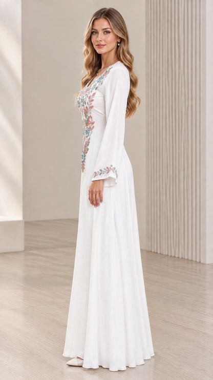 White embroidered maxi dress side view showing graceful drape