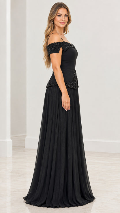 Side profile of black cold-shoulder beaded pleated maxi dress