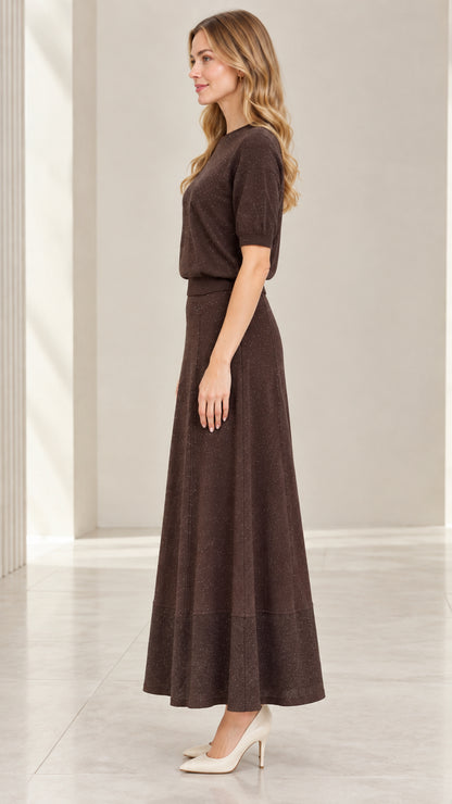 Side profile view of model wearing coffee brown two-piece sparkle knit skirt set