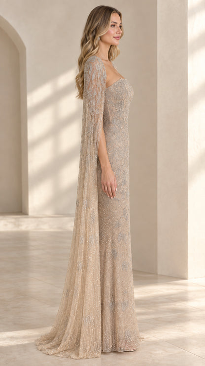 Side angle of model in champagne sequined formal gown showcasing cape drape