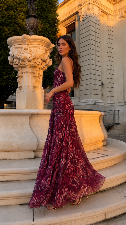 Side view of wine printed spaghetti strap maxi dress showing fluid drape