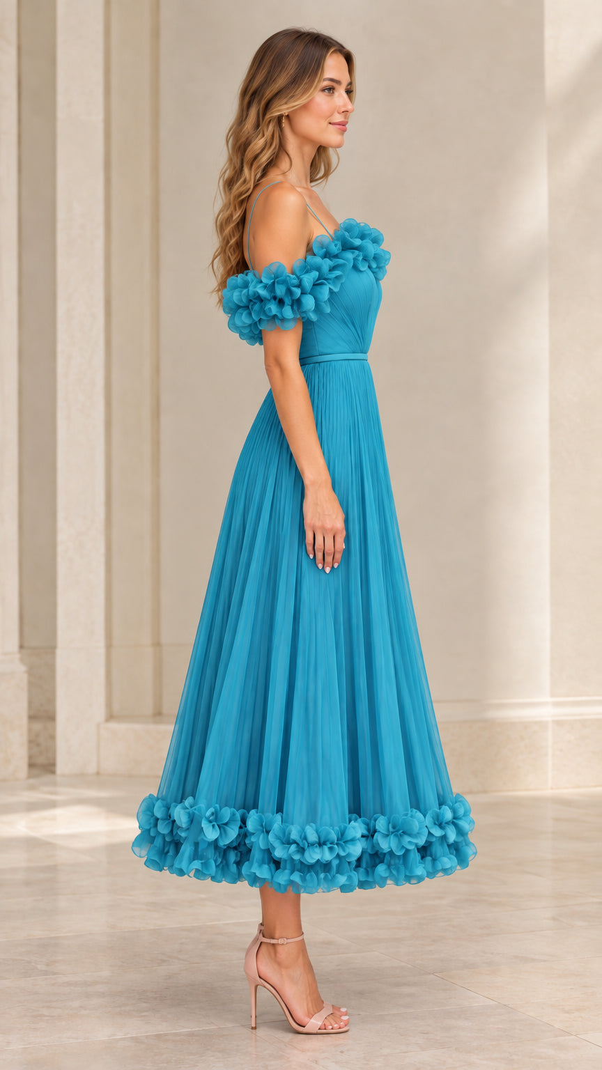 Side profile view of teal blue pleated tulle formal dress with floral arm bands