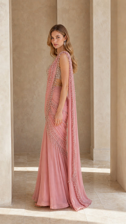 Side profile of dusty pink pre-draped saree gown with shoulder drape
