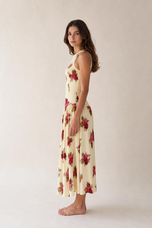 Side profile view of woman in Floral Cream midi dress