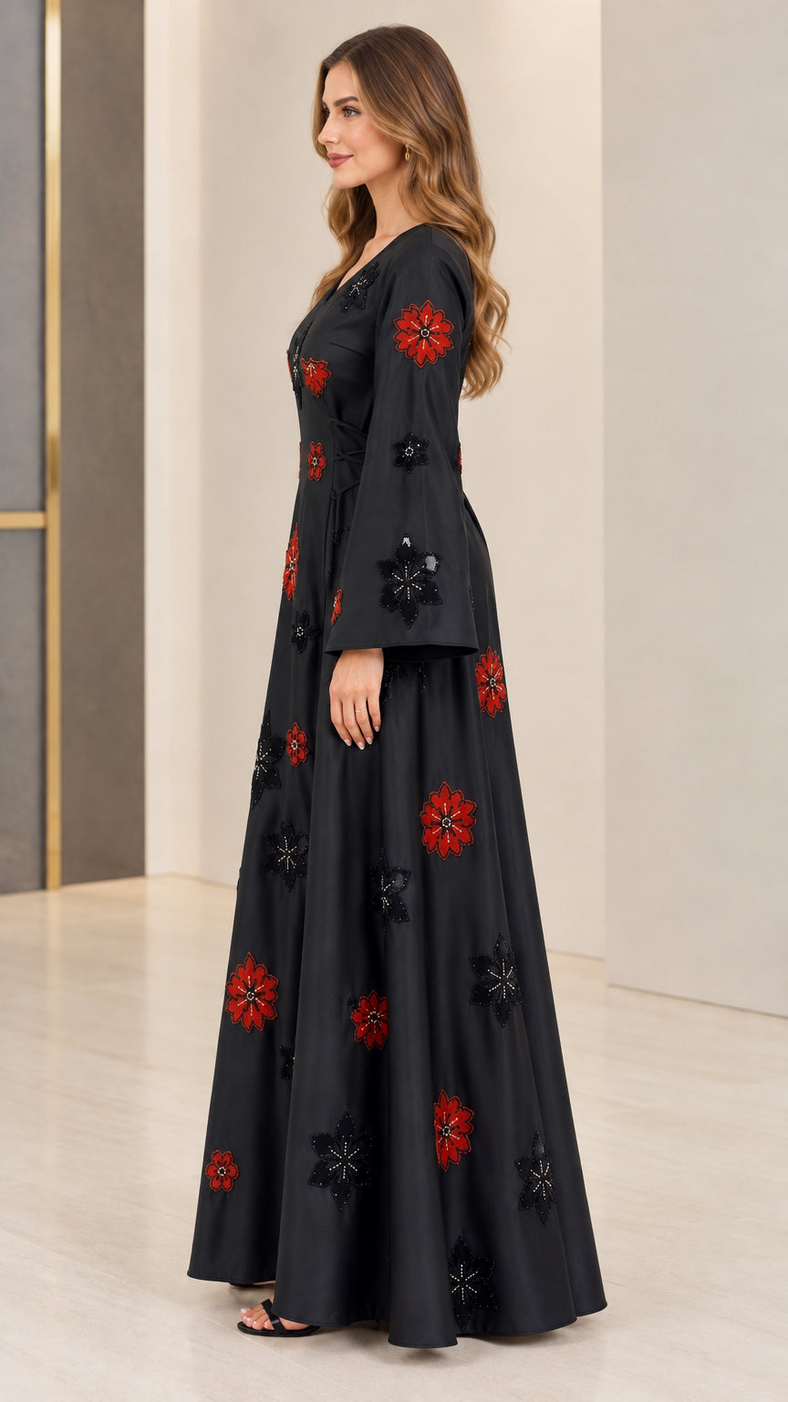 Side profile of woman wearing black floral embroidered evening maxi dress