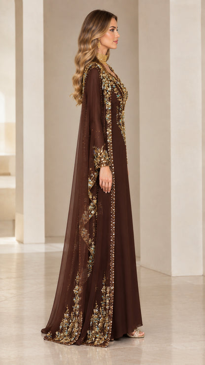 Side profile view of chocolate brown cape evening gown highlighting sheer draped overlay