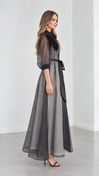 Side profile view of Charcoal Grey organza evening gown with sheer puff sleeves