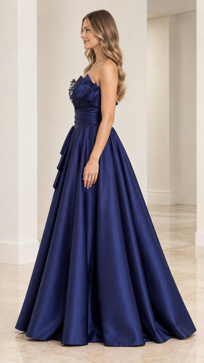 Side profile view of navy blue strapless satin evening gown showing voluminous A-line skirt