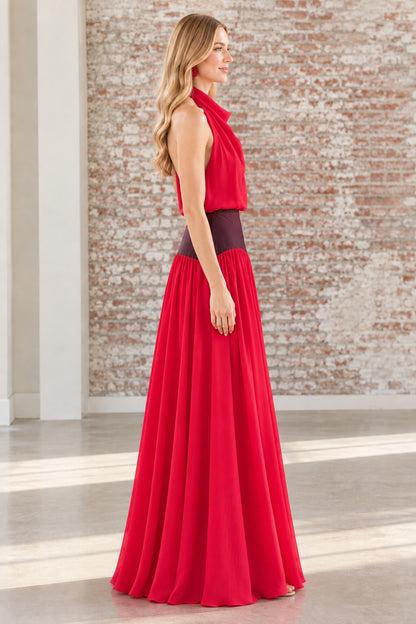 Side profile view of the red backless halter gown showing waist detail