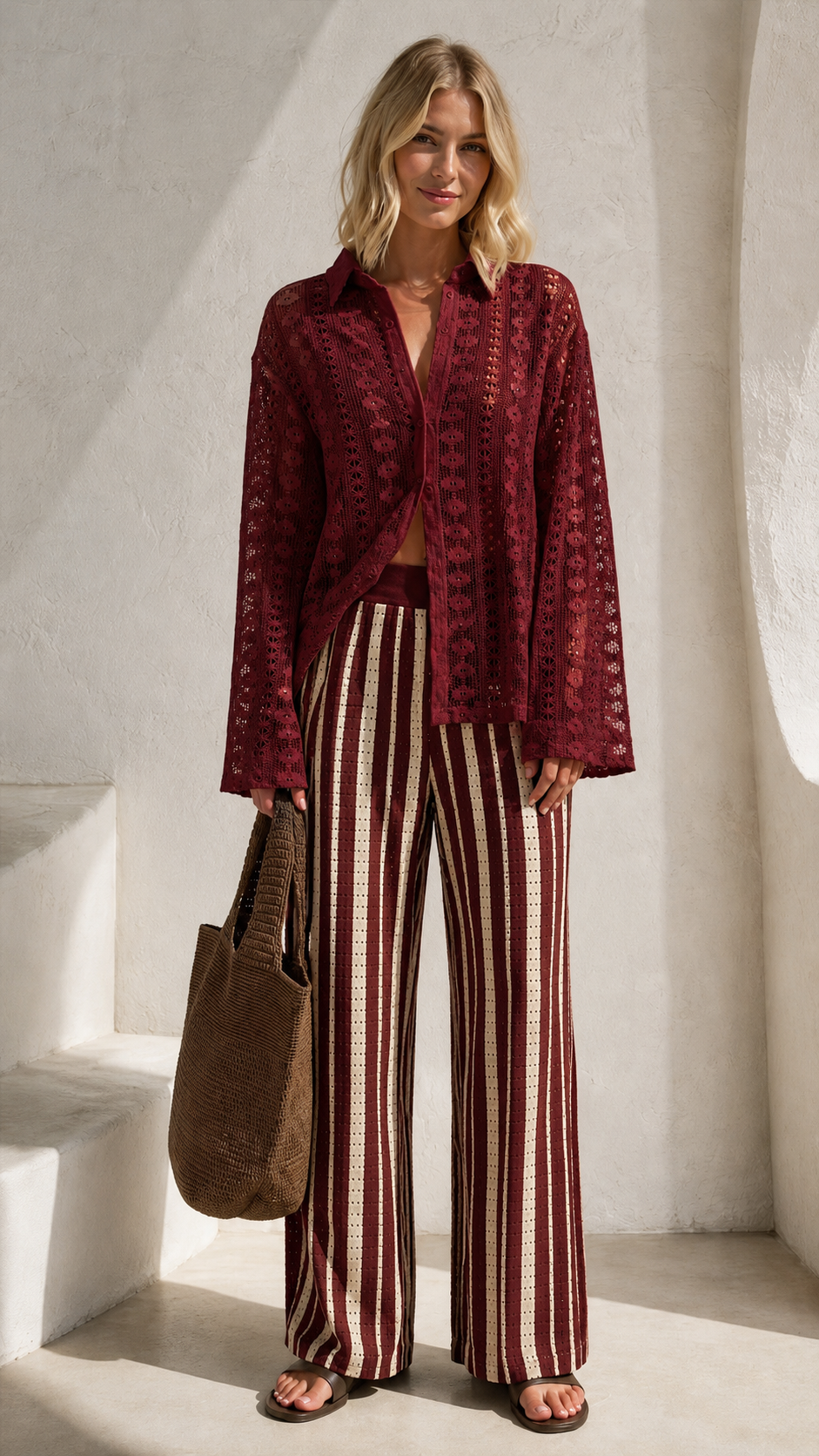 Front view of burgundy lace-look shirt with matching burgundy striped wide leg pants