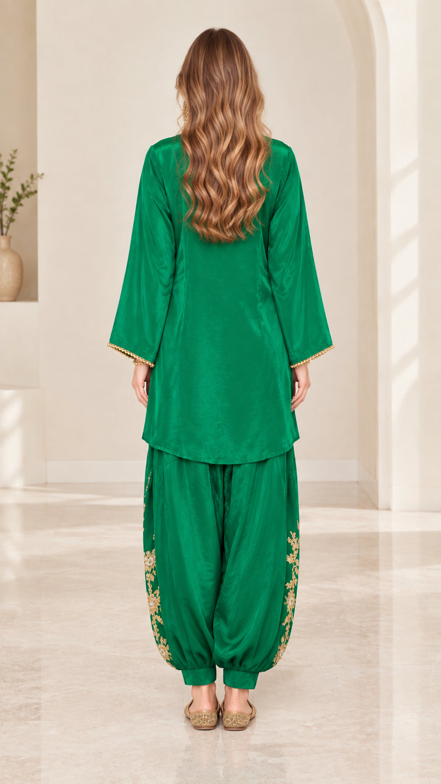 Back view of emerald green silky long-sleeve tunic and gathered pants