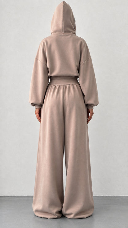 Back view of woman wearing taupe hooded two piece loungewear set
