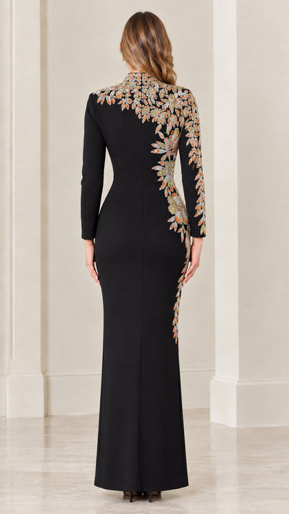 Back view of black long sleeve maxi gown highlighting shoulder embroidery