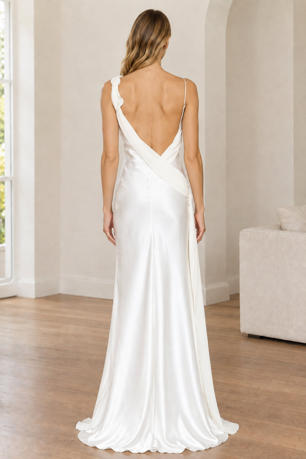 Back view of white satin evening dress showing open low back design