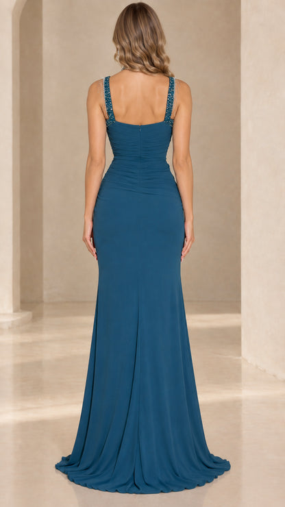 Back view of teal floor-length evening dress with bejeweled straps