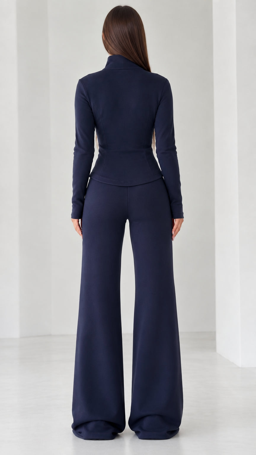 Back view of women's navy blue long sleeve top and wide-leg trousers