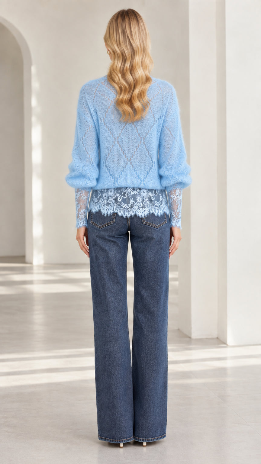 Back view of model wearing light blue diamond knit sweater with lace hem