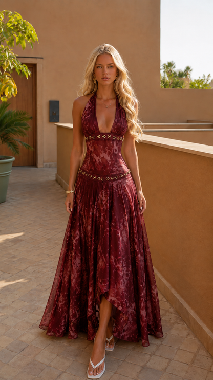 Front view of burgundy halter backless maxi dress with deep V neckline and full skirt