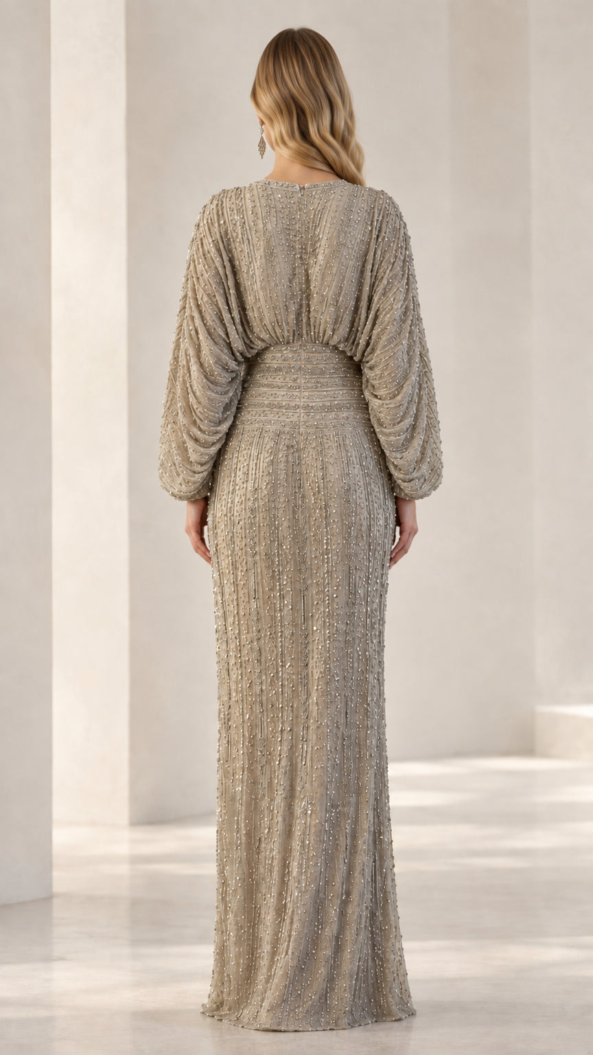 Back view of model in Champagne sequin column gown showcasing fitted waist