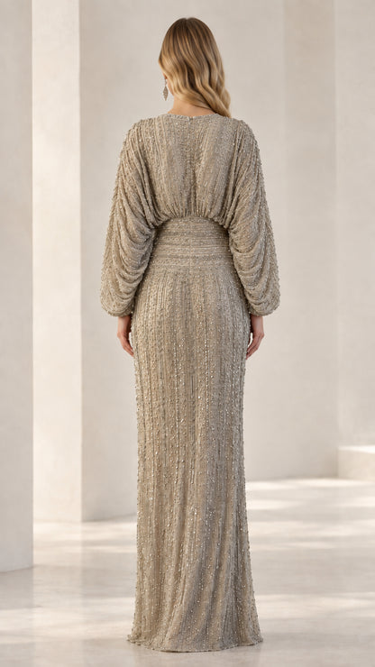 Back view of model in Champagne sequin column gown showcasing fitted waist
