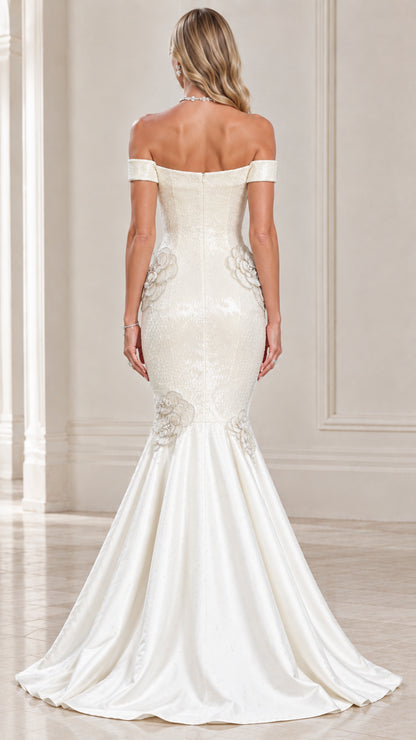 Back view of ivory off-the-shoulder formal mermaid gown showing flared skirt