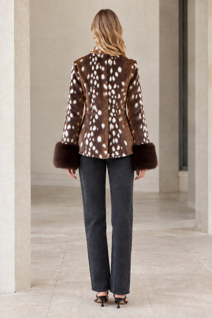 Back view of model wearing brown spotted faux fur jacket