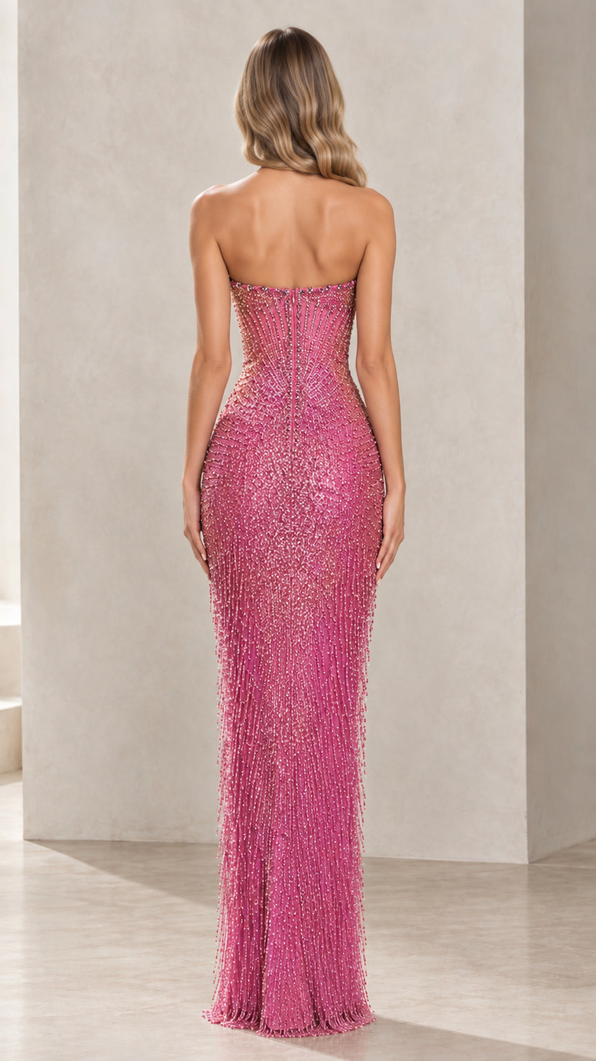 Back view of woman in fitted strapless rose pink beaded formal dress