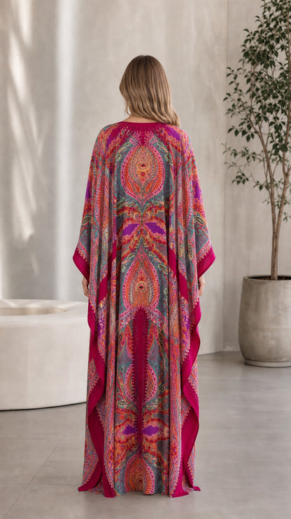 Back view of model wearing Fuchsia paisley print maxi kaftan