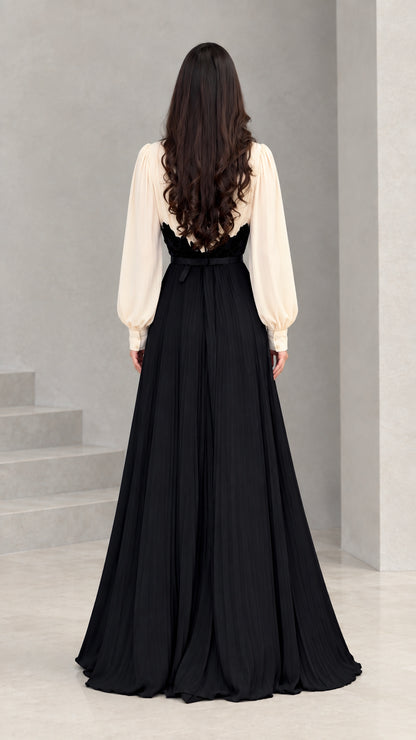 Back view of model wearing cream and black long evening maxi gown