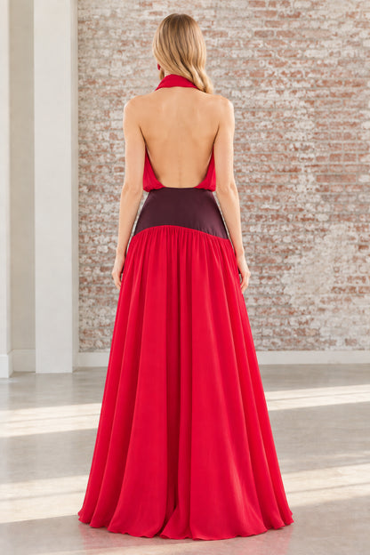 Back view of the red halter maxi dress highlighting the open back design