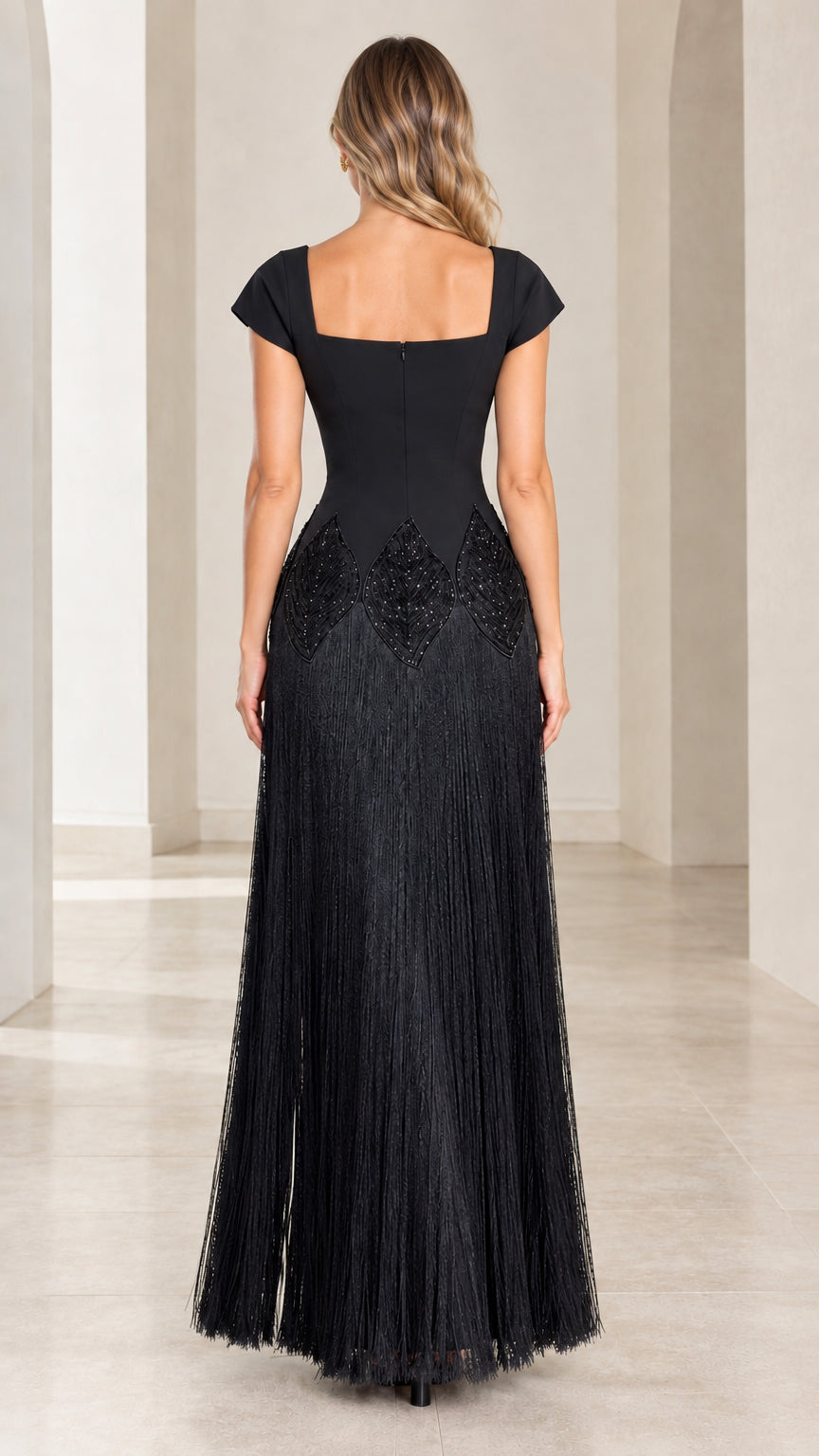 Back view of black square neck cap sleeve fringe maxi dress
